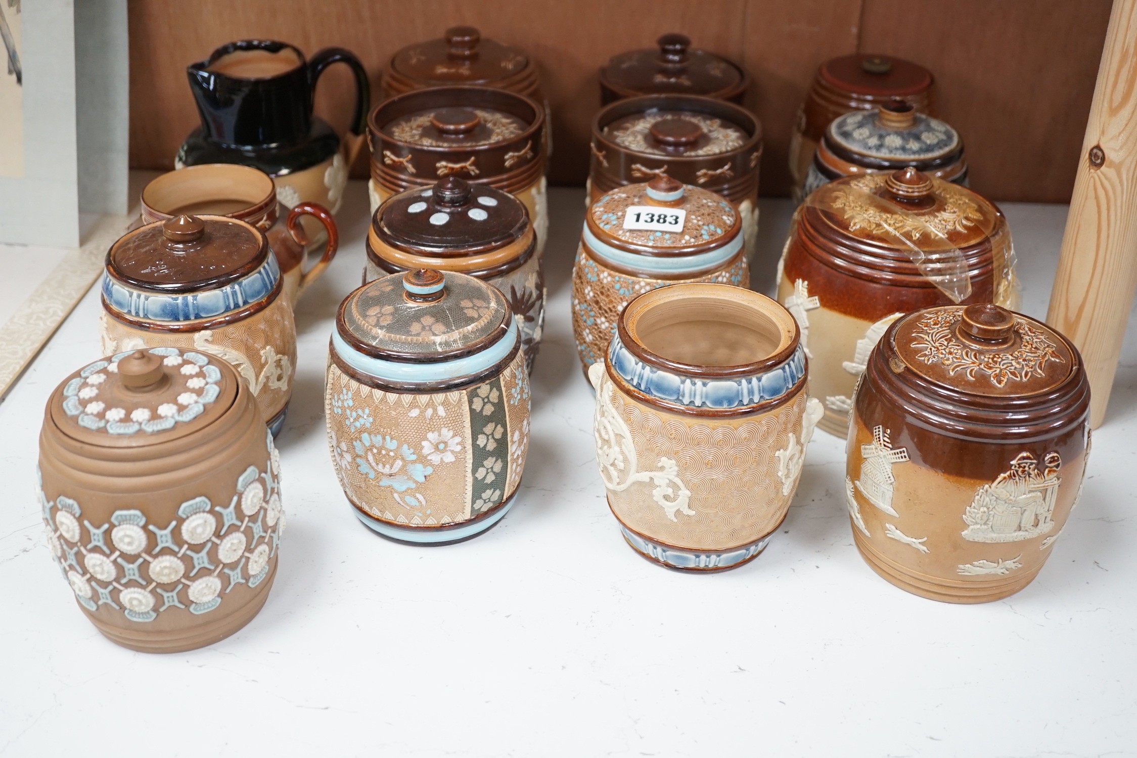 A quantity of Doulton stoneware tobacco jars and jugs